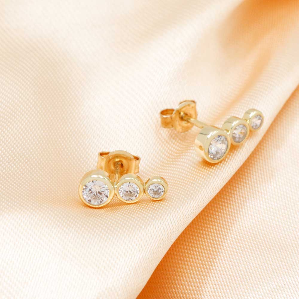 small earrings gold color with zircons lady